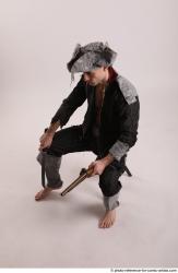 JACK PIRATE SITTING POSE WITH GUN AND DAGGER